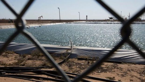 A fracking water retention pond near Big Spring. Wells in the Permian Basin generate six times more water than oil, and companies must dispose of the water through injection wells or other means.