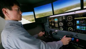 University of Nebraska at Kearney Student in flight simulator