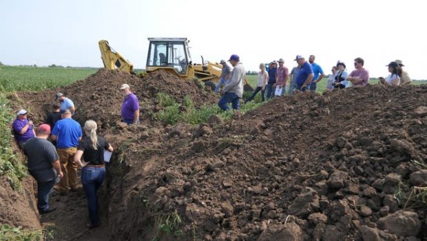 DeAnn Presley, Ph.D., a professor at Kansas State University explains to agronomists and farmers about 30,000-year-old soil that is located in the depths of Kansas cropland on Aug. 31, 2021 on Flickner Innovation Farm in McPherson County.