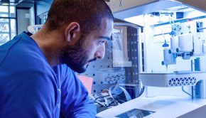 A scientist using a CELLINK 3D bioprinter.
