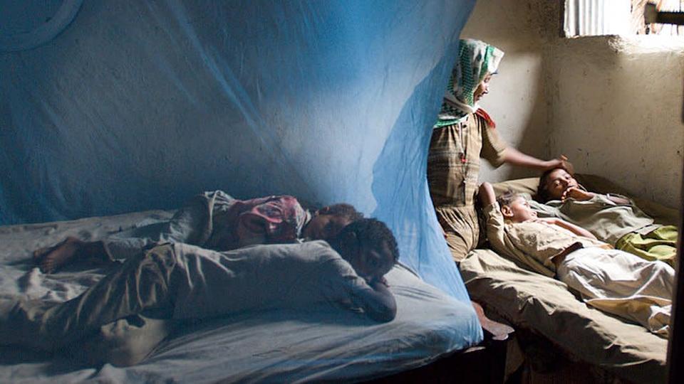 A mother in Ethiopia who doesn't have enough anti-malarial bed nets for all of her children