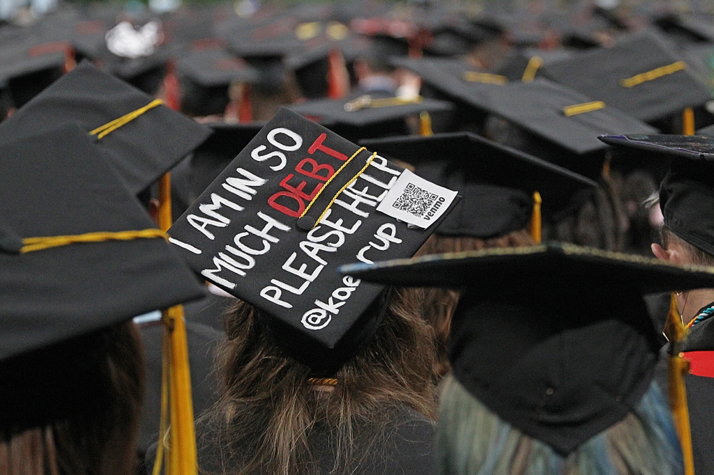 The reality of college tuition debt was on display at the Northeastern University graduation.