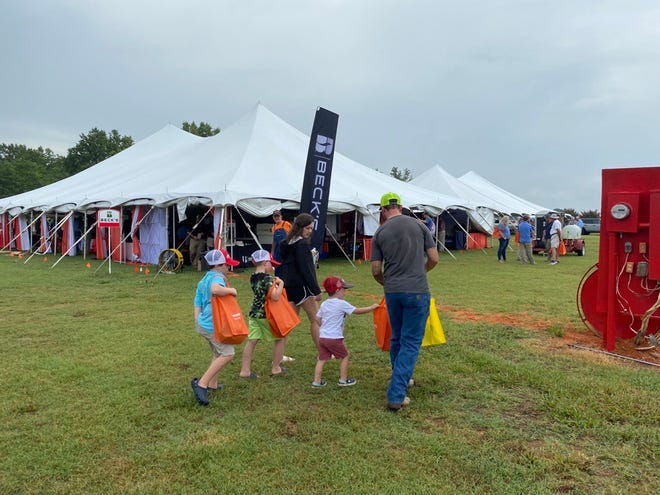 Farmers, young and younger, enjoy the vendor booths and offerings at the 32nd annual “Milan No-Till” Field Day.