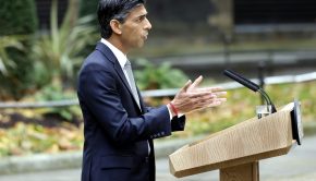 UK Prime Minister Rishi Sunak making speech at podium in London