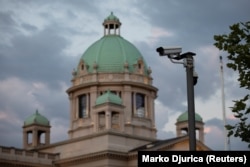 A surveillance camera is seen in front of the Serbian parliament building in Belgrade.