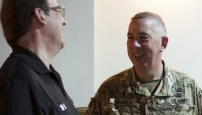 Chaplain (Lt. Col.) Bill Draper of the Kentucky Joint Force Headquarters shares a quick laugh with Keith Wichmann of the John Hopkins Applied Physics Laboratory after a lecture at Cyber Shield 19 held at Camp Atterbury, Ind., April 8, 2019. Draper was enlisted in the Army for 18 years before starting his career as a chaplain in 2004; he has 37 years of service.
