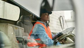 Black Female Truck Driver Photographed Through Window
