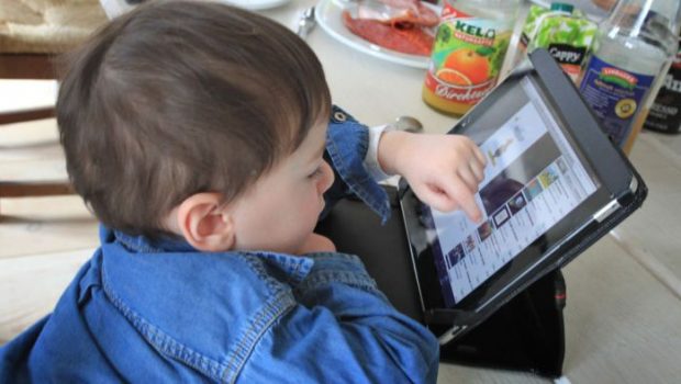 A child completes tasks on a tablet