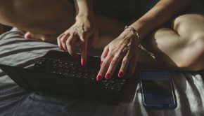 Woman typing on laptop showing cyber risks from remote workers during pandemic