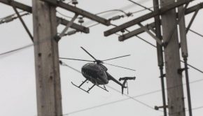 Helicopters inspecting local power lines using infrared, ultraviolet technology