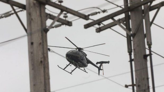 Helicopters inspecting local power lines using infrared, ultraviolet technology