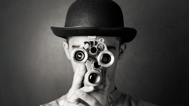 man looking through binocs spy hacker breach infiltrate gettyimages 164644457 by selimaksan 2400x16