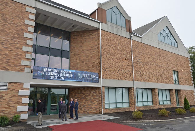 Visitors gather outside Mercyhurst University's Cyber Education Center on Aug. 2, 2018, for the dedication of the $2 million space. Mercyhurst students and faculty will participate this coming week in an international cybersecurity exercise in Buffalo.