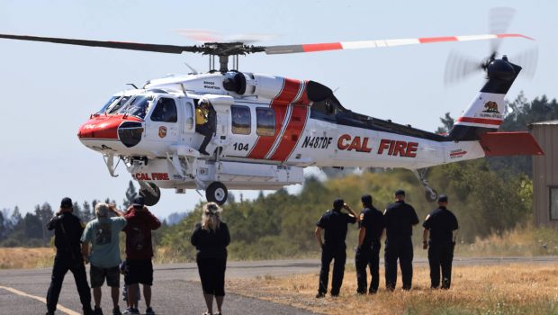 The Boggs Helitack Sikorsky S-70i Cal Fire Hawk helicopter ascends at the Healdsburg airport, Sunday, June 27, 2021 during a tour to familiarize ground firefighters to the newest state of the art  helicopter that will be stationed in Lake County in the Cobb Mountain community.  Cal Fire Capt. Jim Robbins spots for clearance as the craft lifts.  (Kent Porter / The Press Democrat)