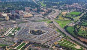 Aerial view of the United States Pentagon, the Department of Defense headquarters in Arlington, Virginia, near Washington DC, with I-395 freeway and the Air Force Memorial and Arlington Cemetery nearb