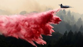 A Cal Fire S-2T airtanker drops fire retardant on a flank of the Walbridge fire near West Dry Creek Road in Healdsburg on Friday, Aug. 21, 2020. The city of Healdsburg is drafting a community wildfire prevention plan to avert such disasters. (Alvin A.H. Jornada / The Press Democrat)