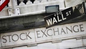 This July 16, 2013, file photo, shows a Wall Street street sign outside the New York Stock Exchange.