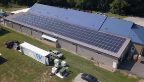 Sycamore International Inc., a Chester County electronics recycler and renovator, wanted to use renewable power around the clock, so it installed a cutting-edge battery system along with its 115-kilowatt rooftop solar system. The iron-flow battery storage system, built by ESS Tech, is located in the white shipping container in the foreground.
