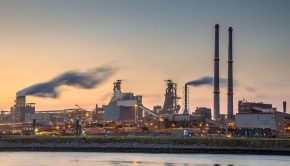 Industrial landscape scene at sunset showing cybersecurity advisory on BlackMatter ransomware targeting critical infrastructure